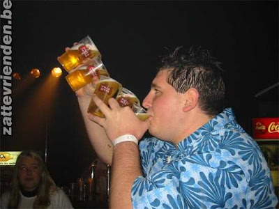 Man drinking a fountain of beer out of 5 glasses