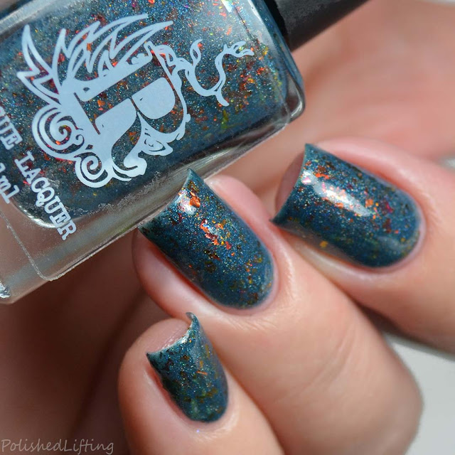 teal nail polish with flakies