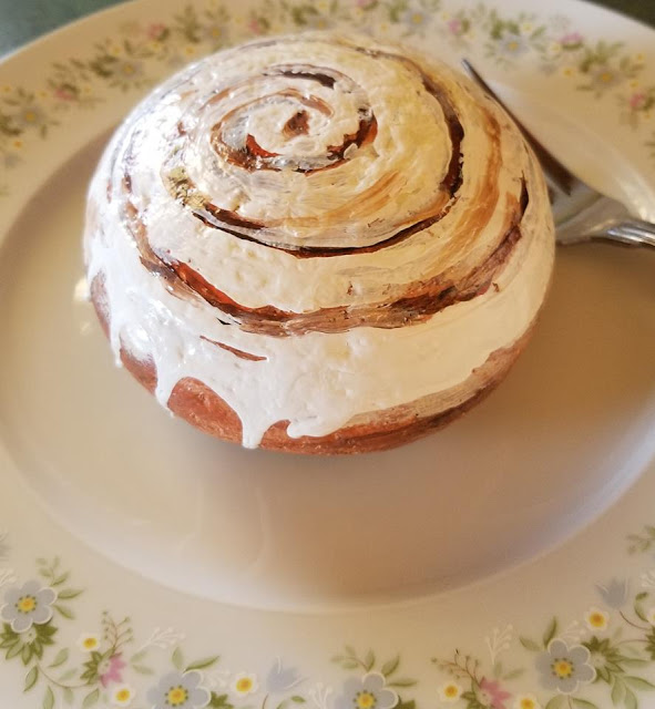 Laura Owen painted this rock that looks like a cinnamon roll