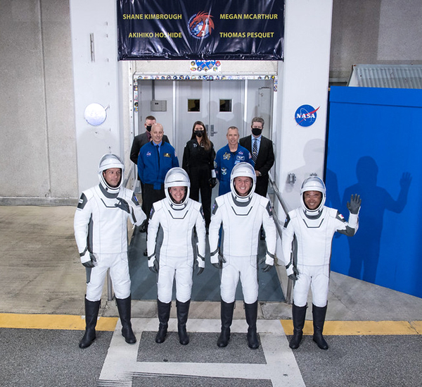 The four Crew-2 astronauts greet their families and friends outside of the Neil A. Armstrong Operations and Checkout Building before heading to Launch Complex 39A, where Falcon 9 and Dragon Endeavour await, at NASA's Kennedy Space Center in Florida...on April 23, 2021.