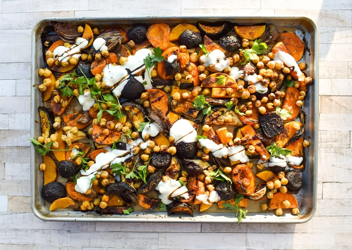 vegetable and chickpea traybake on baking sheet