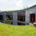 Stone House with Grass Roof and Central Garden