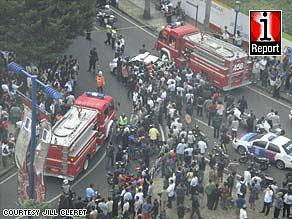 A crowd gathers in Jakarta in the aftermath of the blasts