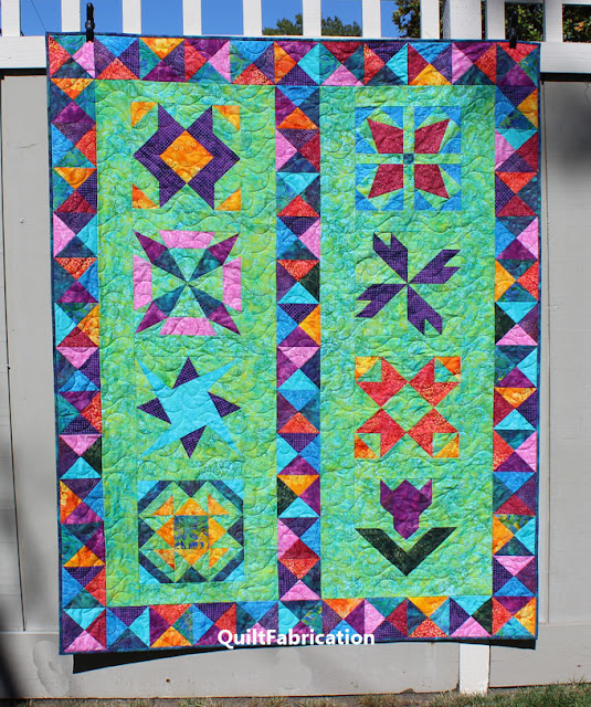 colorful batik quilt with 8 different blocks