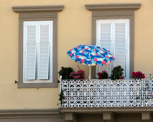 Balcony with flowers and a parasol, Viale Italia, Livorno