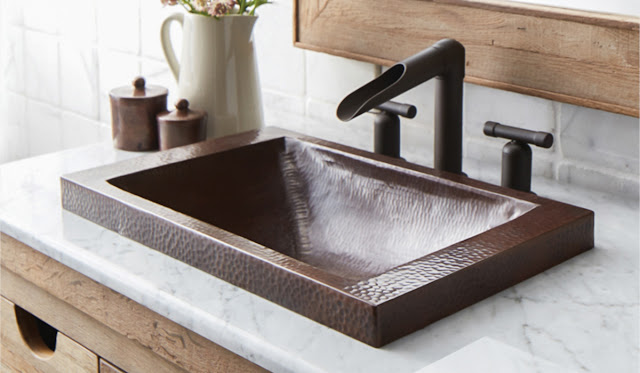 Hammered copper metal sink by Native Trails.