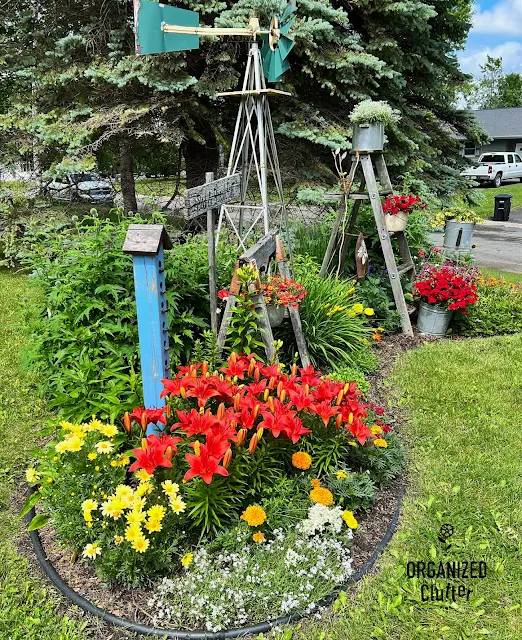 Photos of annuals, perennials, & junk in my front yard border.