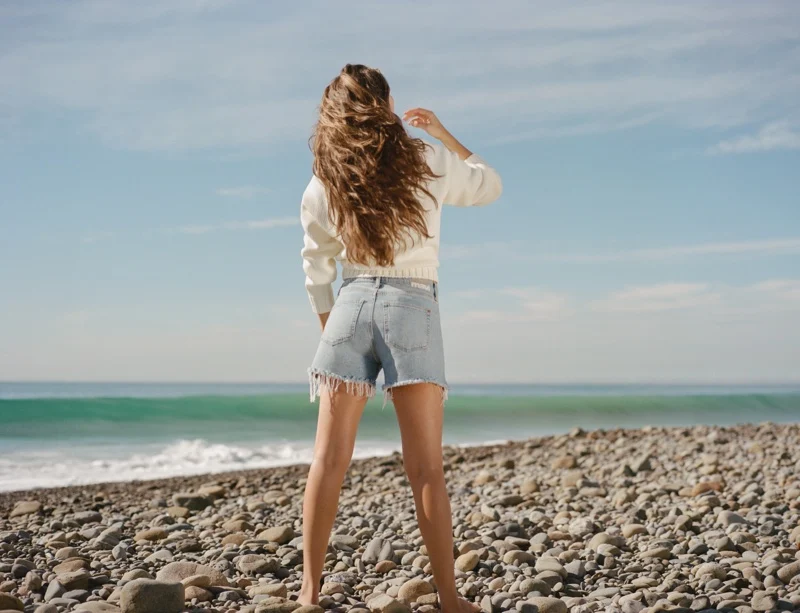 Rachel Connor shows off cut-off denim shorts for the Mavi spring 2024 campaign