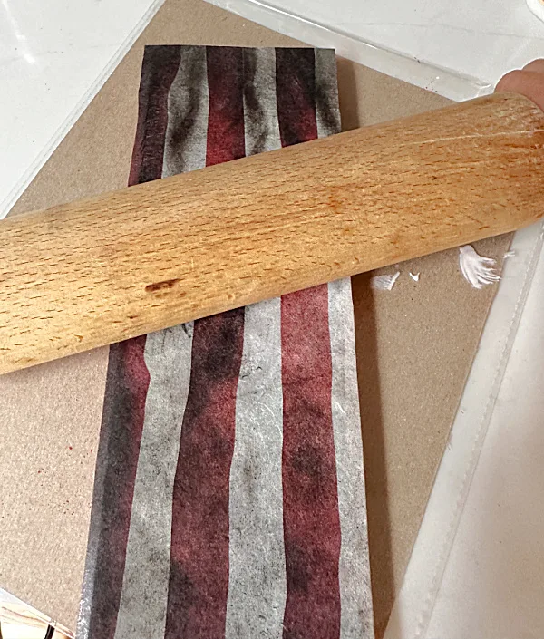 rolling pin on shelf with flag image
