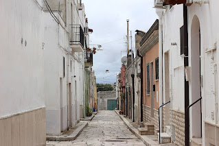 Via Acerenza is typical of the narrow, cobbled streets that fan out from Spinazzola's main street