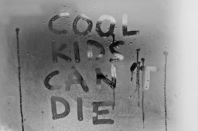 Cool Kids Can Not Die written on frosted mirror