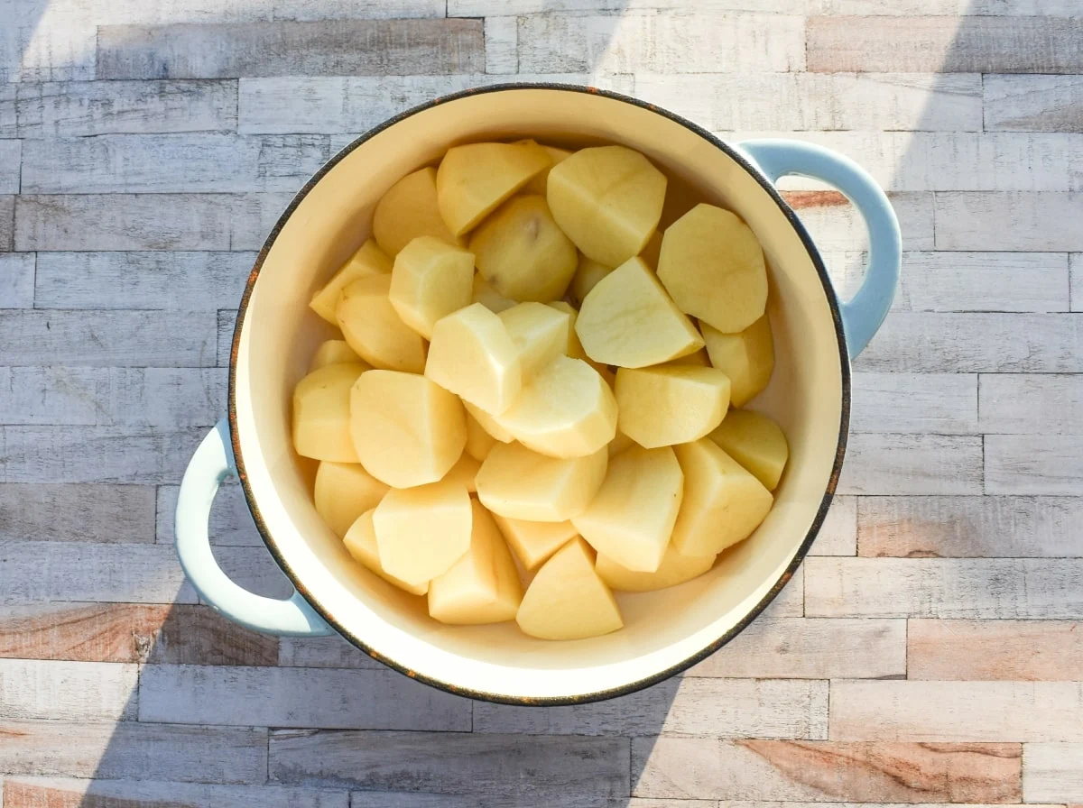 Tatties in a pan of cold water.