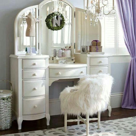 white makeup table with storage and chair