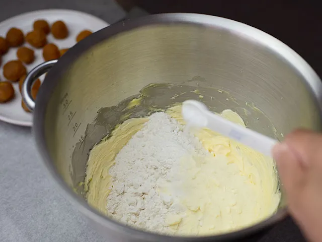 Sieve plain flour, corn flour and baking powder at least twice.