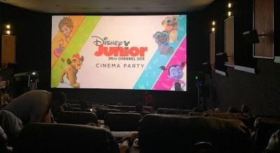 Inside cinema with screen: "Disney Junior Cinema Party" 