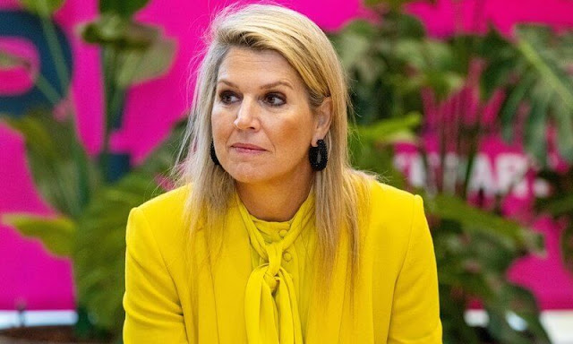 Queen Maxima wore a new yellow satin tie neck blouse by Zara. Yellow double breasted blazer and trousers by Zara