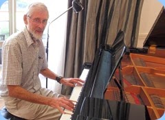 Errol Storey playing the grand piano. Photo courtesy of Dennis Lyons.