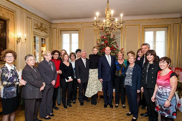 Prince Albert and princess Charlene of Monaco presented gifts to old people and children at "Red Cross" Monaco branch