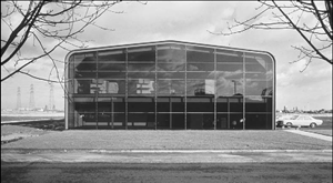 Portal frame expressed internally behind a glazed-end elevation 