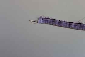 pull the needle out from other end