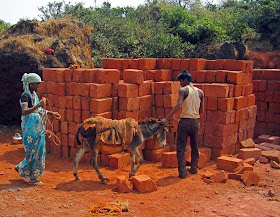 workers loading bricks