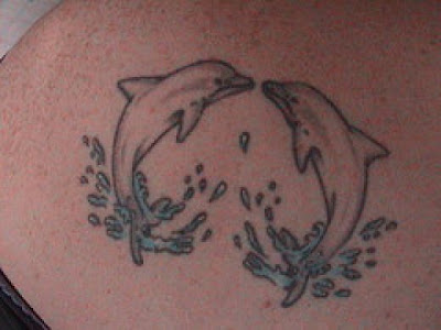 small dolphin tattoo designs for girls. small dolphin tattoo designs for