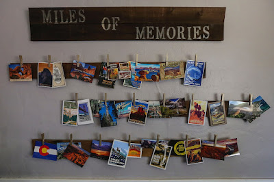 Postcard wall display of travel memories