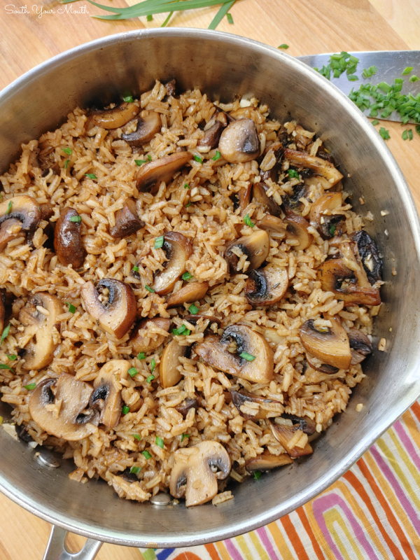Garlic Butter & Mushroom Rice! Fresh mushrooms sautéed with garlic and butter cooked with rice on the stovetop in a savory, beefy stock for a quick and easy side dish.