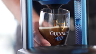 Guinness zero alcohol being poured by a bartender