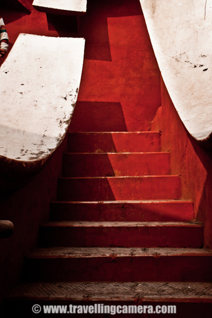 Some Experiments with old architecture of Jantar Mantar in Delhi, INDIA : Posted by VJ SHARMA on www.travellingcamera.com : Last month me and one of my friend were waiting for other folks to reach Connaught Place in Delhi and they called us to inform that all of them are arriving after 1:30 Hrs... This was good opportunity for us to explore some place nearby and decided to visit Jantar Mantar... After reaching the place I was not able to decide what should I shoot... Everywhere people were roaming and it was really difficult to find a place without people... and it was not like two or three folks.. It was huge crowd in front of each yantra @ Jantar Mantar.. So finally I decided to have some photographs which can avoid this crowd and it gave a good opportunity to place with various angles/compositions... check out and critics are welcome !!The first photograph where I wanted to have darkest possible shadows to make it look like black tiles in contact with reds and white ones.. Although it doesn't look like that... I would have to wait to click this photograph at right time but we had to move out in few hrs... Never mind, I will try it again...This time I was carrying SONY Alpha-700 and was confused with some of the controls.. Anyway that's not important... These yantras were very narrow is shape and it was difficult to fit myself for clicking these architecture forms nicely... Here is a tilted view of a semi-spherical yantra @ Jantar Mantar...All these photographs from the same yantra and it was was quite interesting... But please don't ask me about how it functions and what it is supposed to do...Stairs hidden behind these structures and everyone needs to follow them to go down and see the real work inside these yantras.. In Jantar Mantar at jaipur, everyone was not allowed to go inside these structures but in Delhi I didn't see such restrictions except one which had highest structure followed by lot of stairs....Jantar Mantar in Delhi is a very popular place among activists, social associations and artists as well... Many of the NGOs choose this place to start a rally or protest... Also many artists have explored this very well and many times Photographers have exhibited this place...A Series of small pillars taking all the weight of small paths connecting outer circle of a structure with a pole in the middle... as you can see the turning path in a circle...One of my friend called it 'Stairs of Success'.. I don't if that is the name of these stairs but like the caption :)Final Photograph showing the close-up view of this architecture which shows the age of this structure and its been repaired multiple times in past which resulted in this roughness... I am again planning to visit Jantar Mantar in Delhi and will ensure that I get full day to spend there...