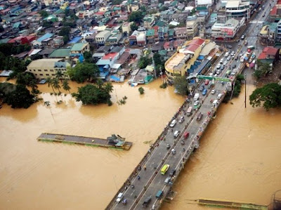 Photo taken on August 8, 2012 and released by the Department of National Defense (DND) shows an aerial shot of the overflowing Marikina river in suburban Manila