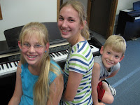 Music brings families together - photo of kids at piano