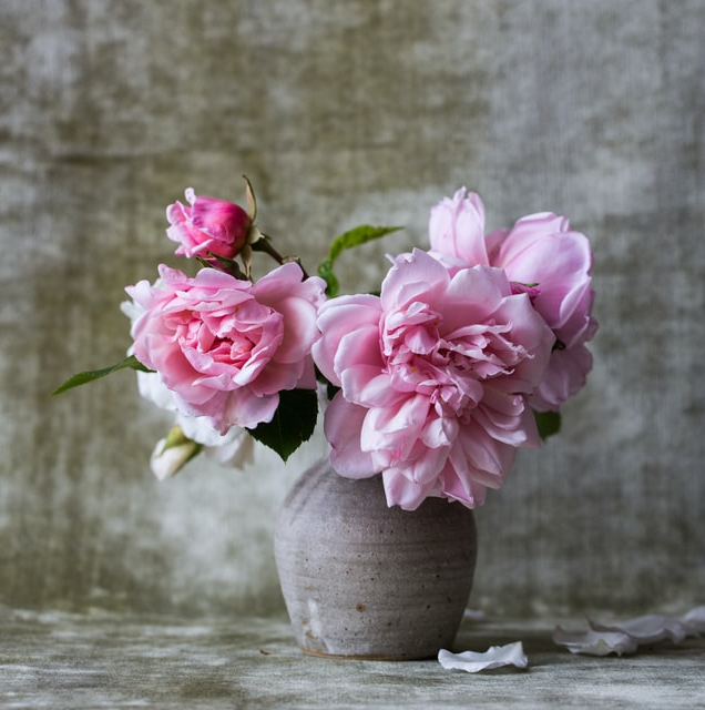 pottery vase with pink flowers