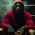 Boxer sitting in a corner of boxing ring…