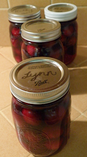 Four Jars Cherries Labeled with Names