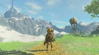 standing next to the Hateno Ancient Lab, with view on Robbie's balloon and Mount Lanayru