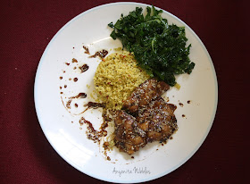 A plate of sweet & hot baked sesame chicken with couscous and raw kale salad from www.anyonita-nibbles.com