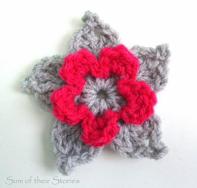 grey and bright crochet flower