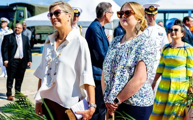 Princess Amalia wore a Vaige top by Munthe, and dancing yellyfish earrings by Barong Barong. Maxima wore a silk blouse by Natan