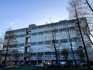 A photo of Linksview House from the nearby park on Tolbooth Wynd.  It is a grey concrete block of flats built in the Brutalist style.  Photograph by Kevin Nosferatu for the Skulferatu Project.