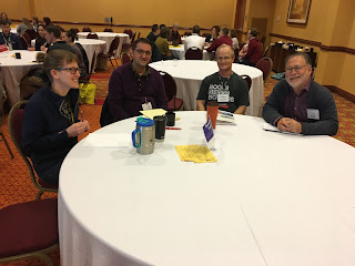 people gathered around a table smiling