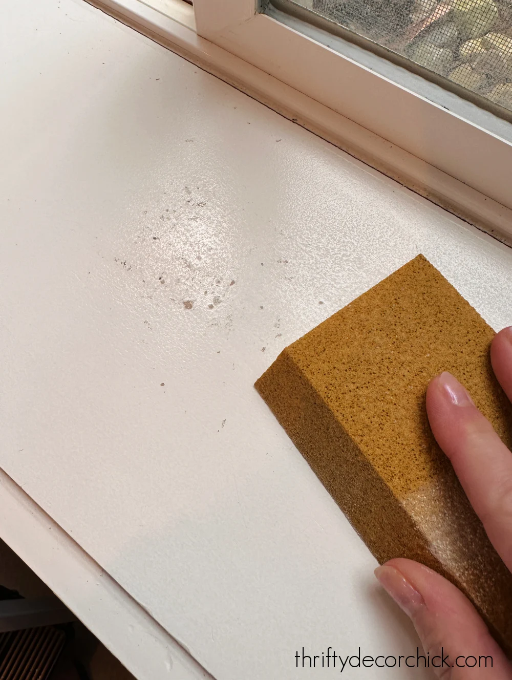 sanding damaged window trim