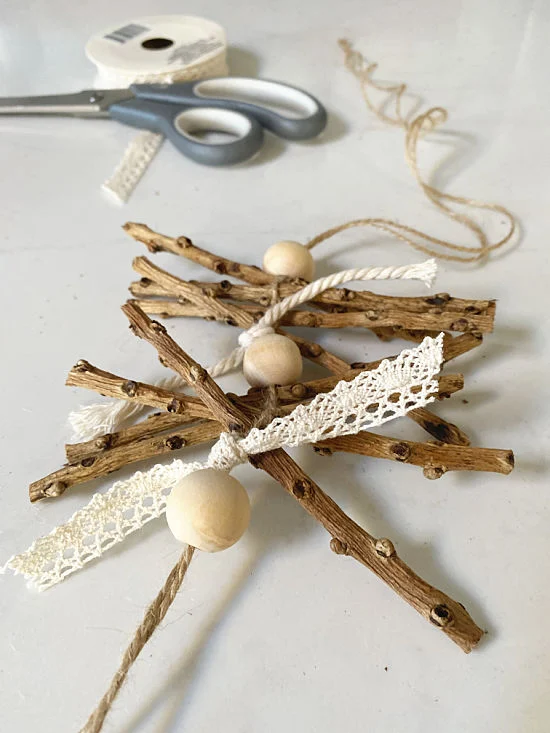 sticks beads and lace ribbon