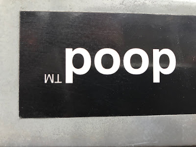 dood sticker turned upside down to read as "poop"