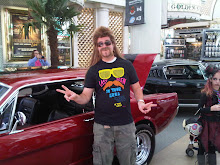 Shayne dressed as Joe Dirt in front of Papa's Car