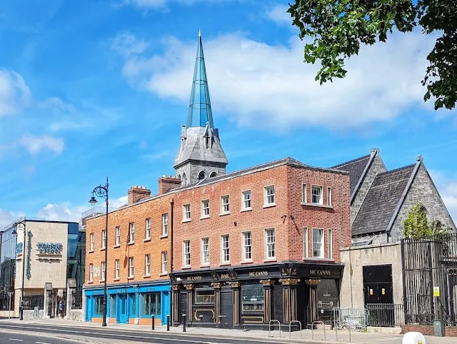 Glass tower of Pearse Lyons Distillery viewed from the street in the Dublin Liberties