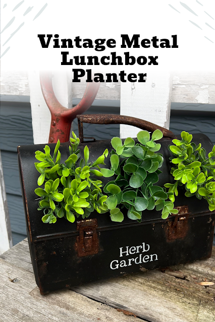 Photo of vintage metal lunchbox repurposed as an herb planter.