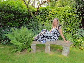 zig zag dress  from JD Williams website modelled in a green and leafy garden