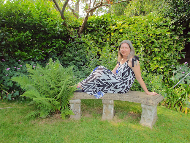 zig zag dress  from JD Williams website modelled in a green and leafy garden