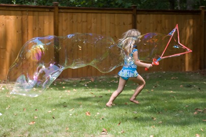 Erika running with bubble blog